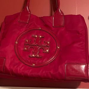 This Tory Burch is used and has a few flaws but is truly and beautiful bag.